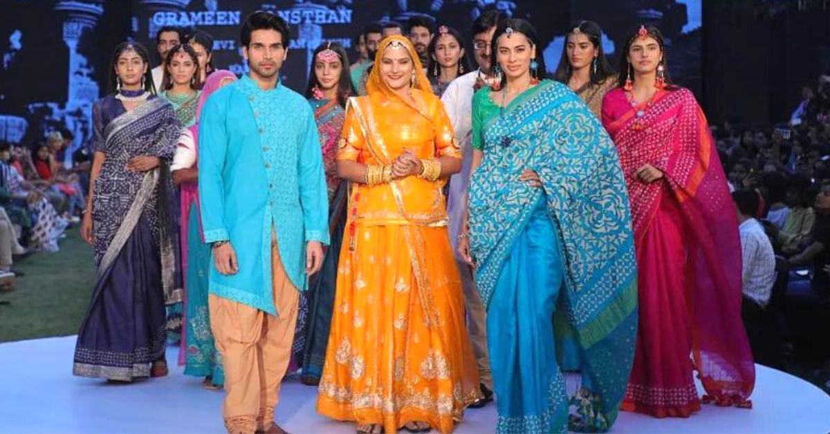 rajasthan artisan ruma devi walks an indian fashion show with models sporting her collection