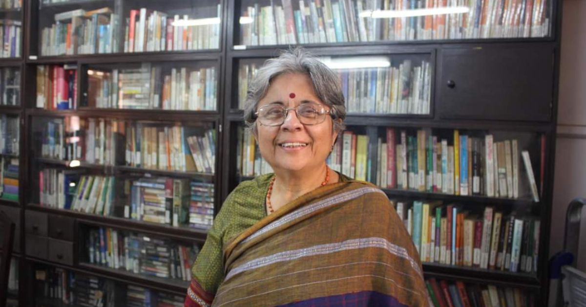Indian activist and feminist icon sonal shukla stands in the library at vacha foundation in mumbai