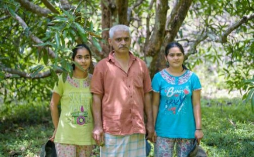 Exotic fruit farmer from Karnataka with his twin daughters.