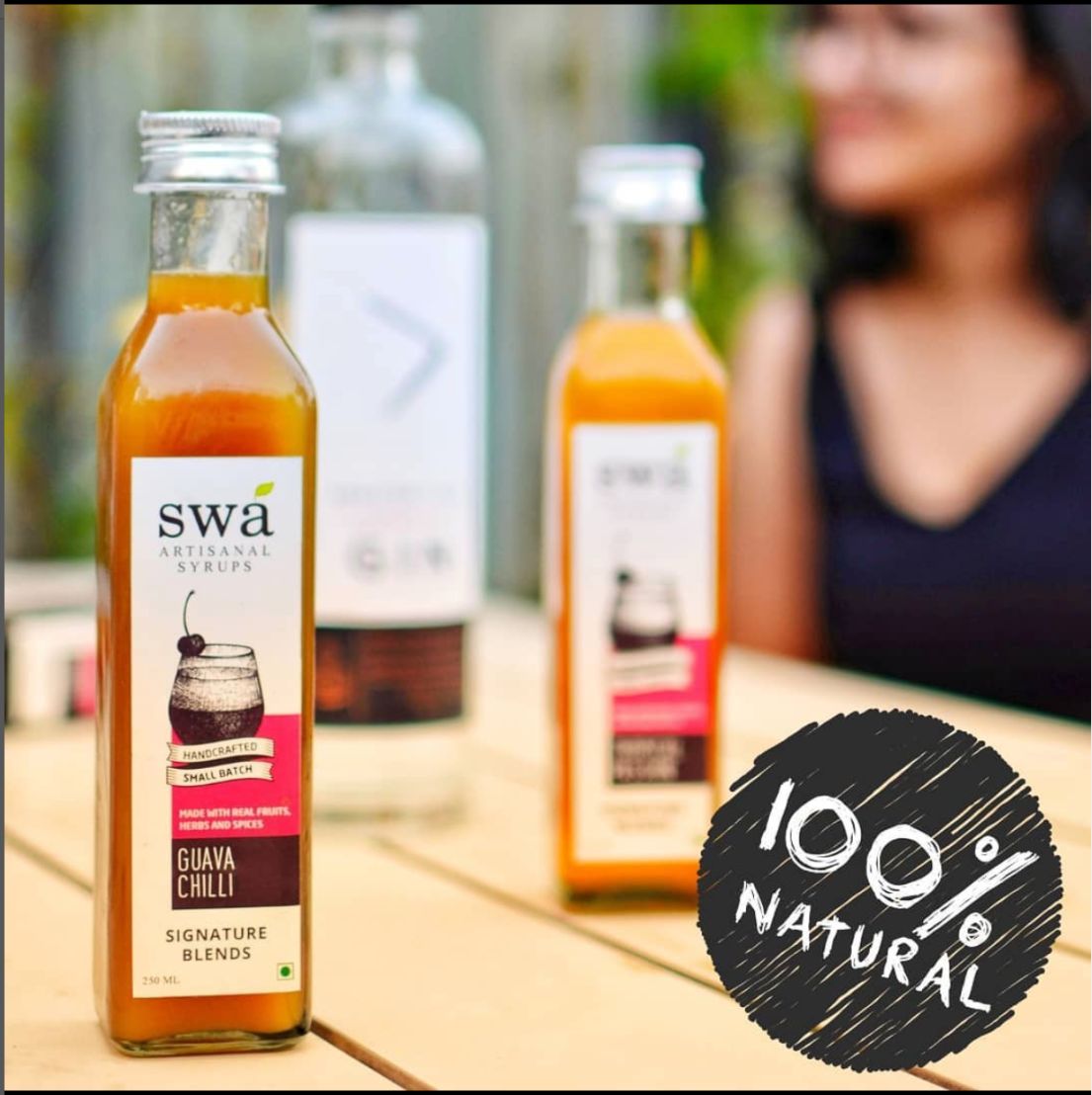 swa guava chilli artisanal syrup bottle on a wooden table 