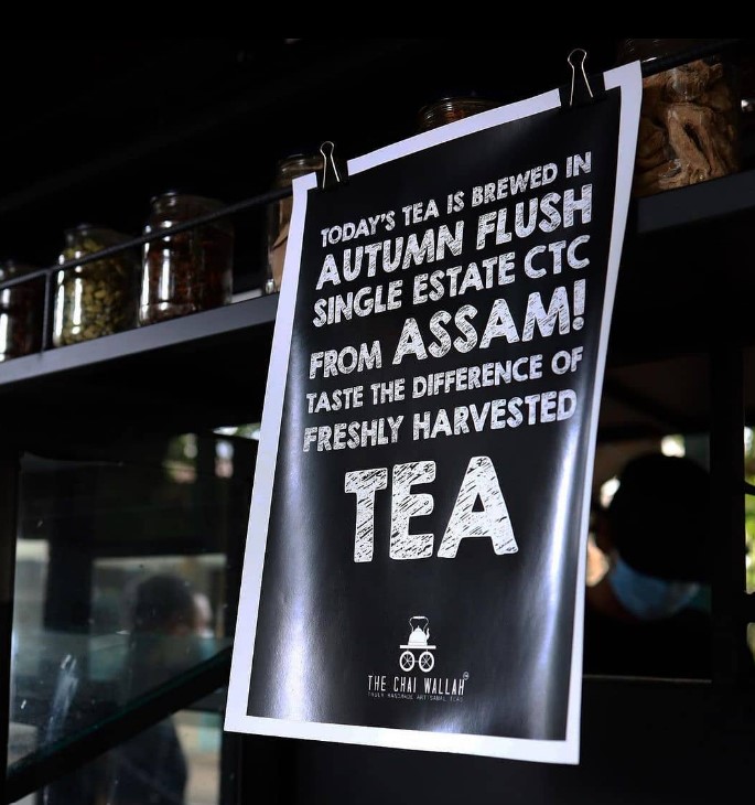 a banner displaying availability of authentic assam tea at chai wallah 