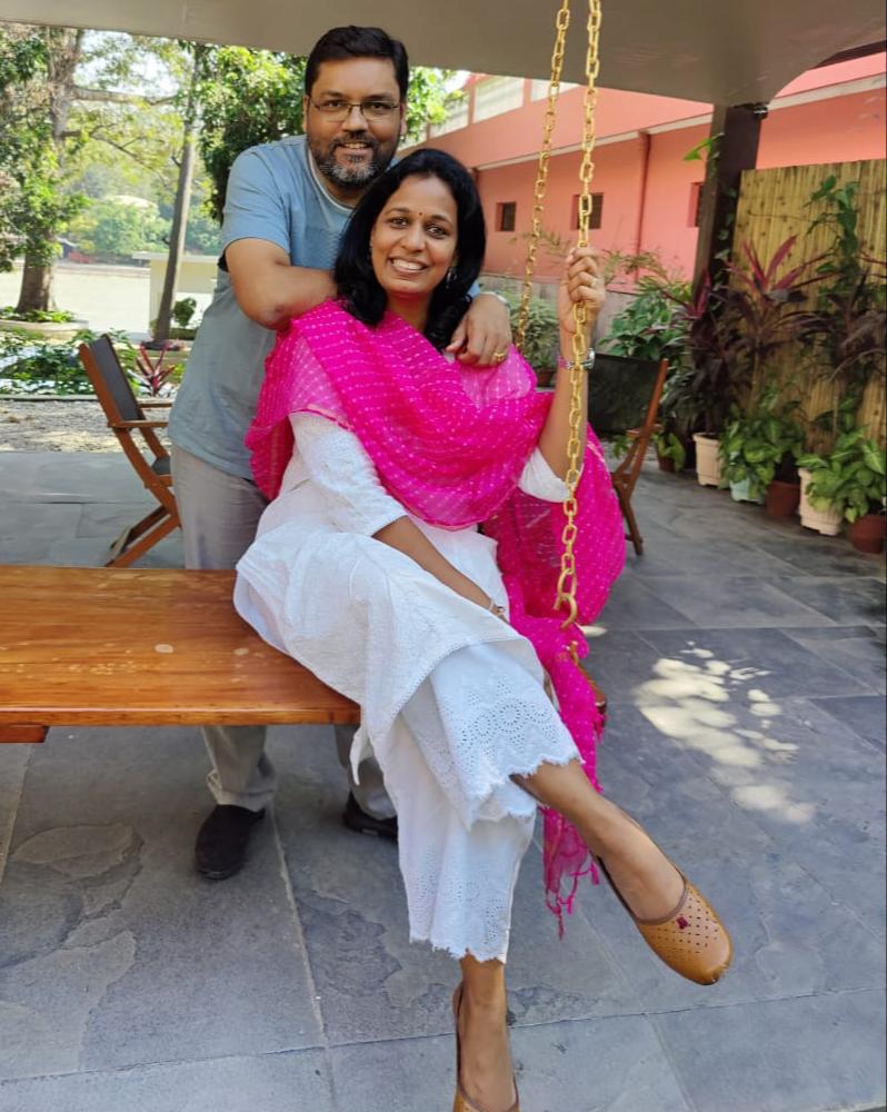 Surabhi with her husband on a swing. 