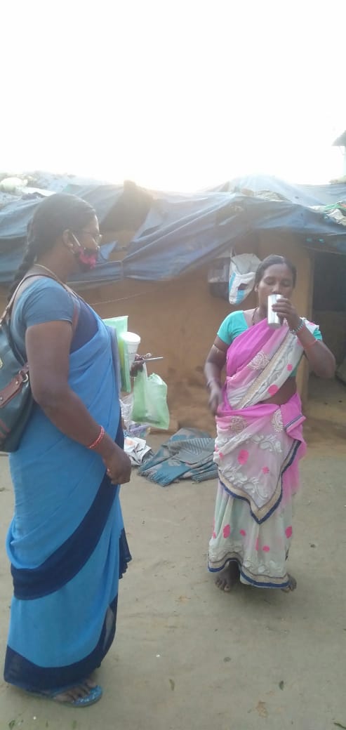 Matilda Kullu with a villager. 