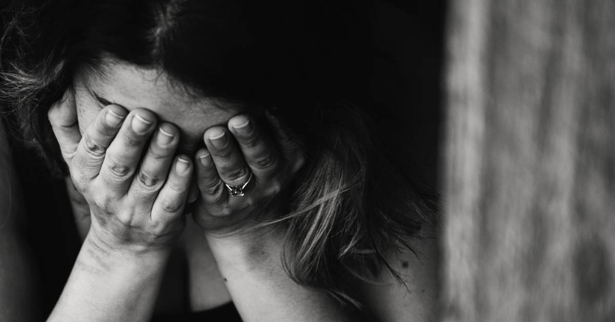 black and white photo of woman crying 