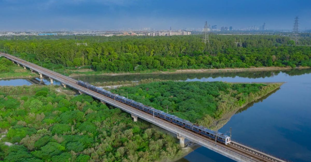 aerial view of the delhi metro and yamuna river