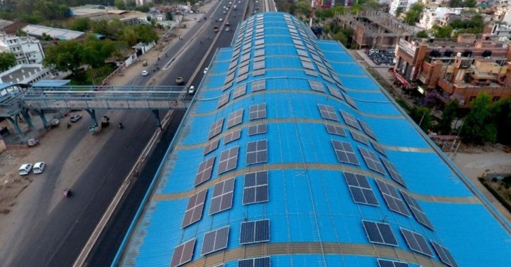 aerial view of solar panels on the roof of a delhi metro station  