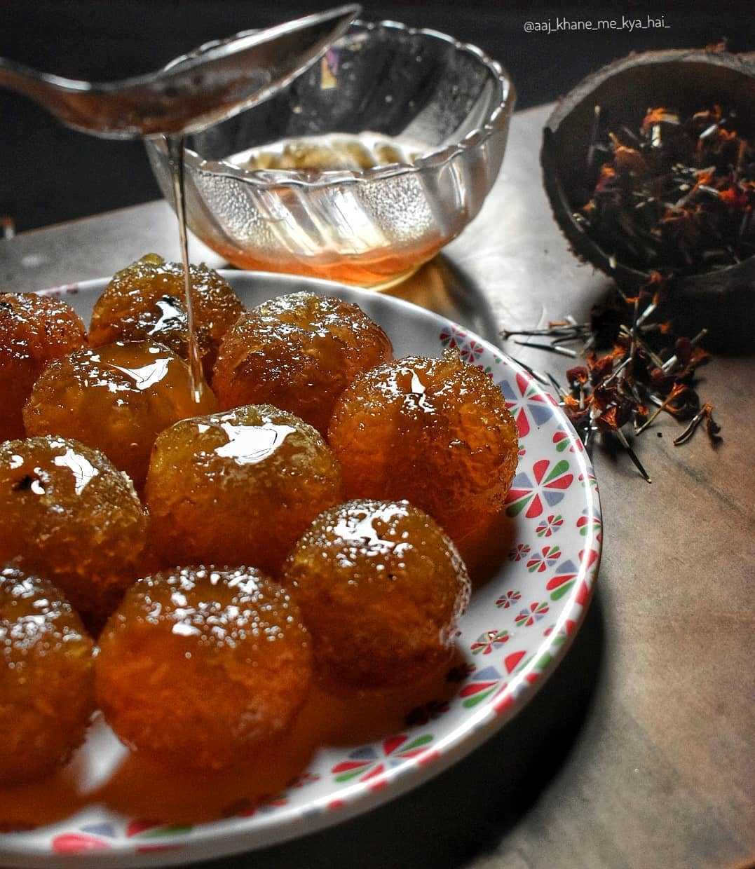 Amla soaked in sugar syrup to prepare amla murabba