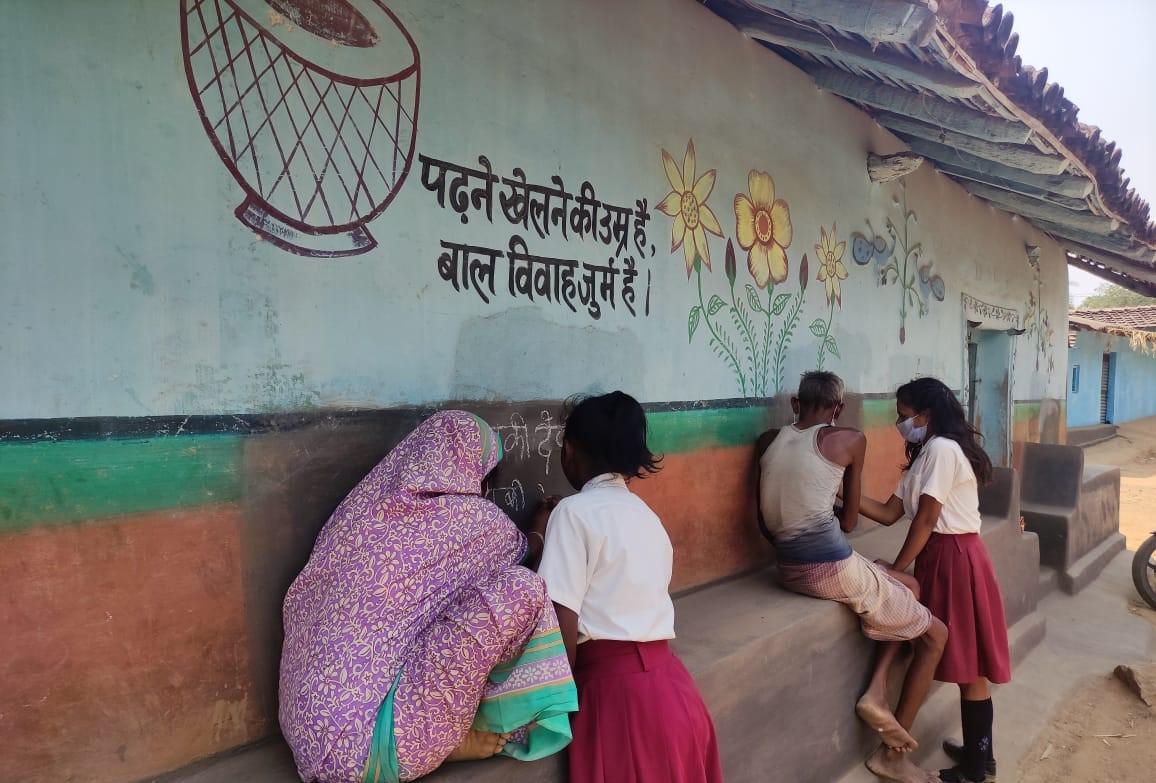 Children doing adult education in Dumka, Jharkhand.