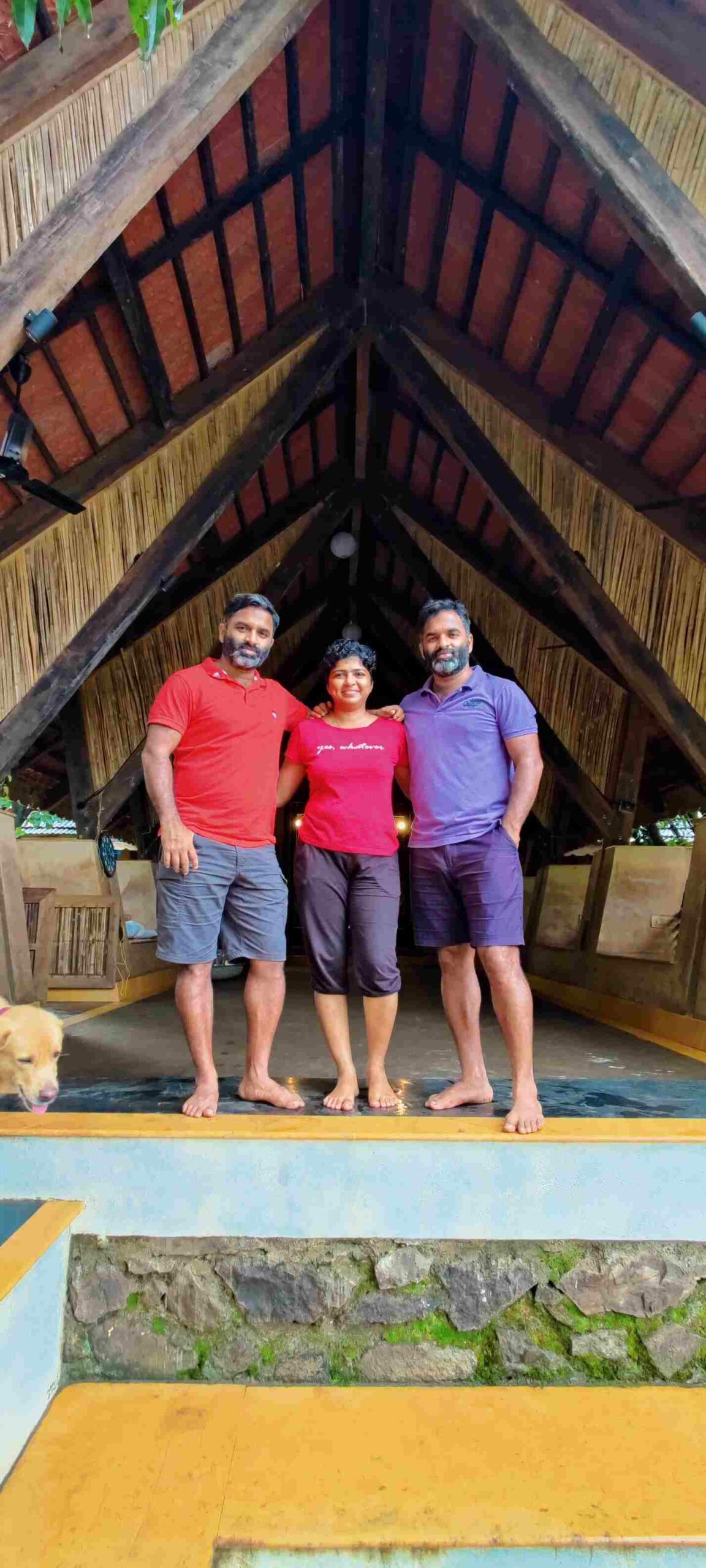 The Adhikari family standing in front of their farmstay in Thane, Maharashtra