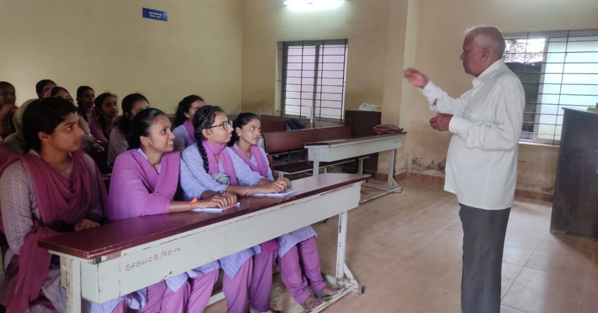 Narayana Naik with students from a government college in Mangaluru.