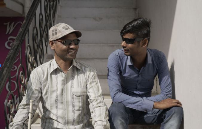 Rakesh Kumar Soni (left) with one of his students
