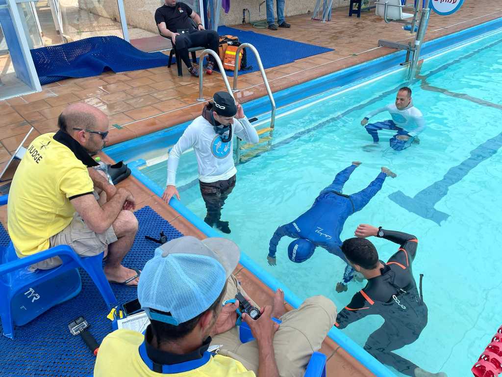 India's freediver holding his breath under water. 