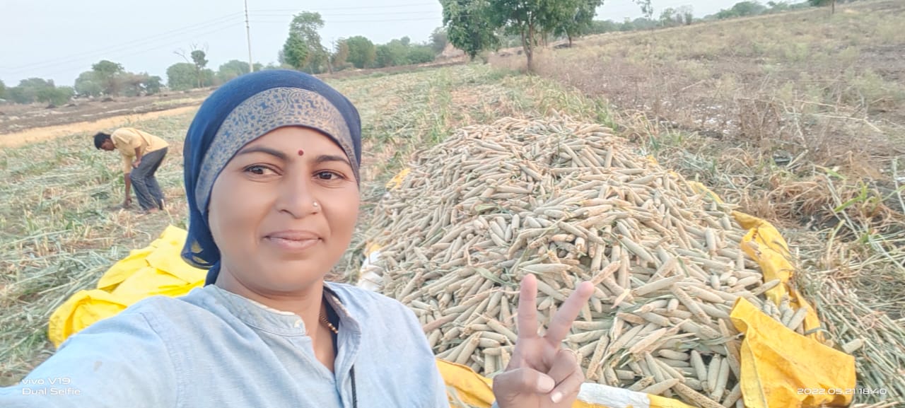Savita on her field, enjoying the benefits of her hard work. 