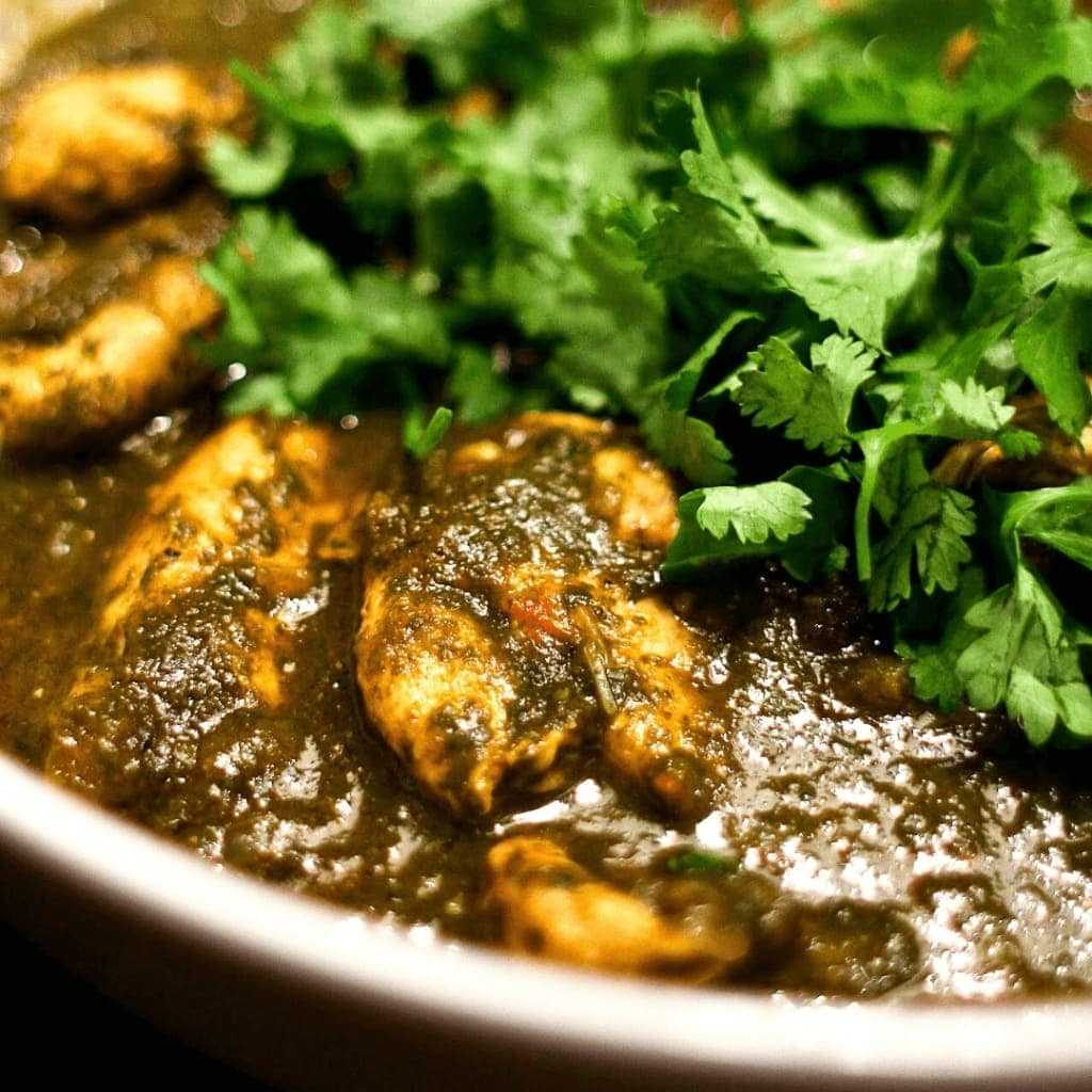 Saagwala Murg made with turmeric, cinnamon, garam masala, spinach and pan fried chicken