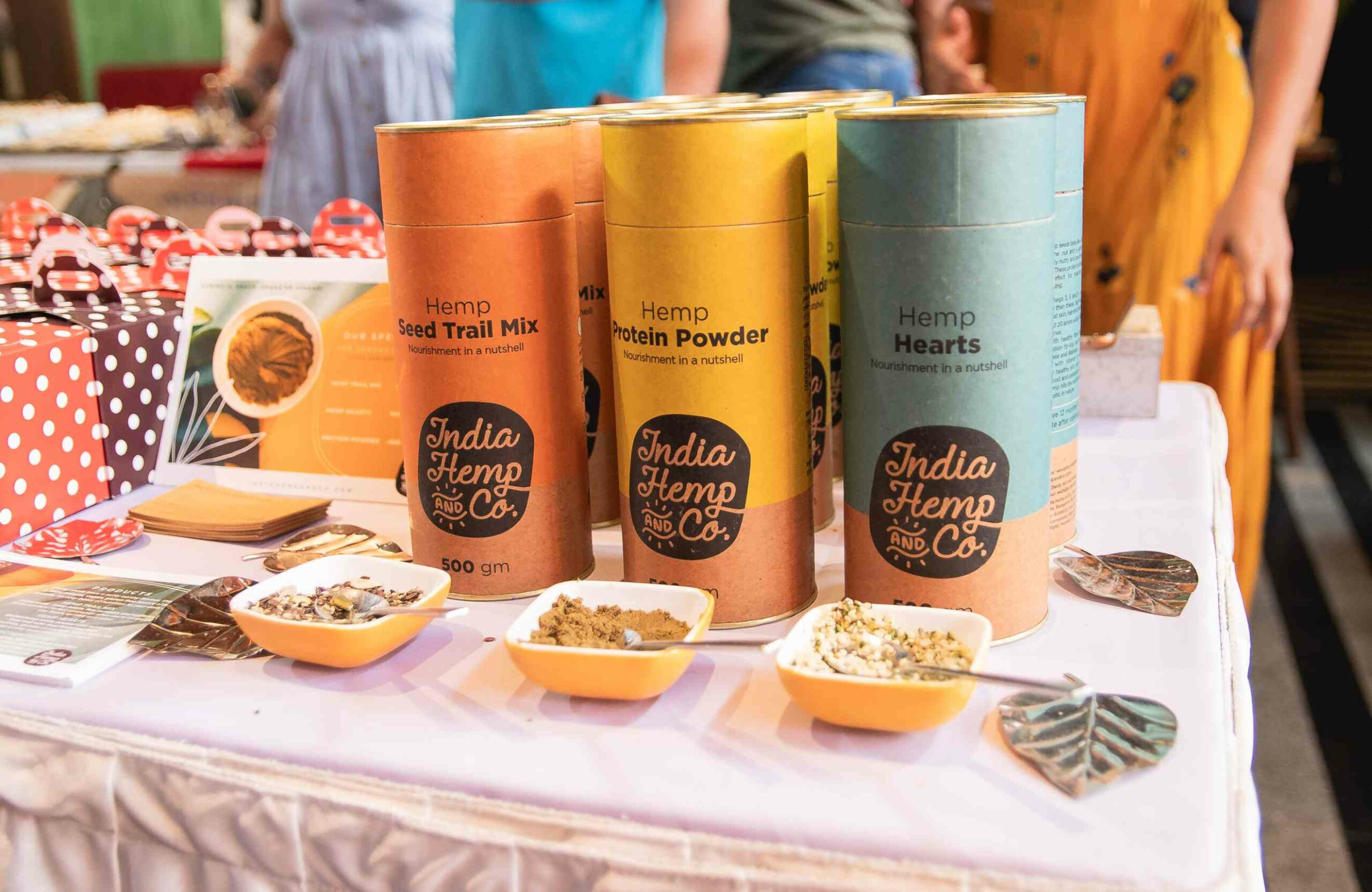 Product canisters by India Hemp & Co. at an exhibition. 