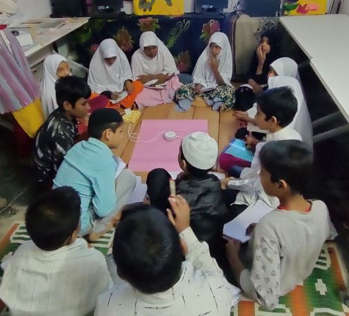 Students interact with Alexa at GUHPS Venkateshapura, a government Urdu school in Bengaluru.

