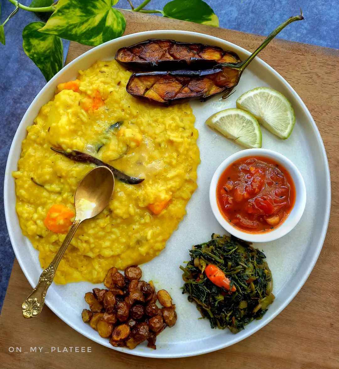 Traditional masala khichdi with pickle, brinjal and potato sabzi