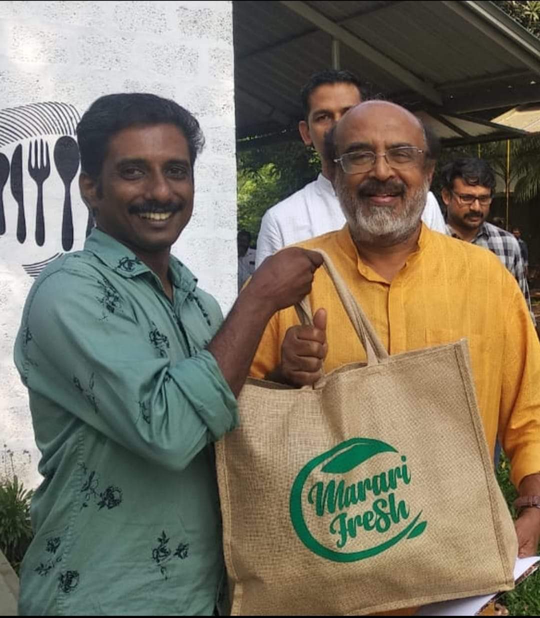 kerala farmer Nishad with former state finance minister Dr Thomas Isaac