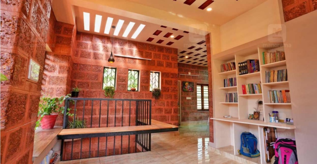 sustainable house in thrissur which is made of red stone and mud