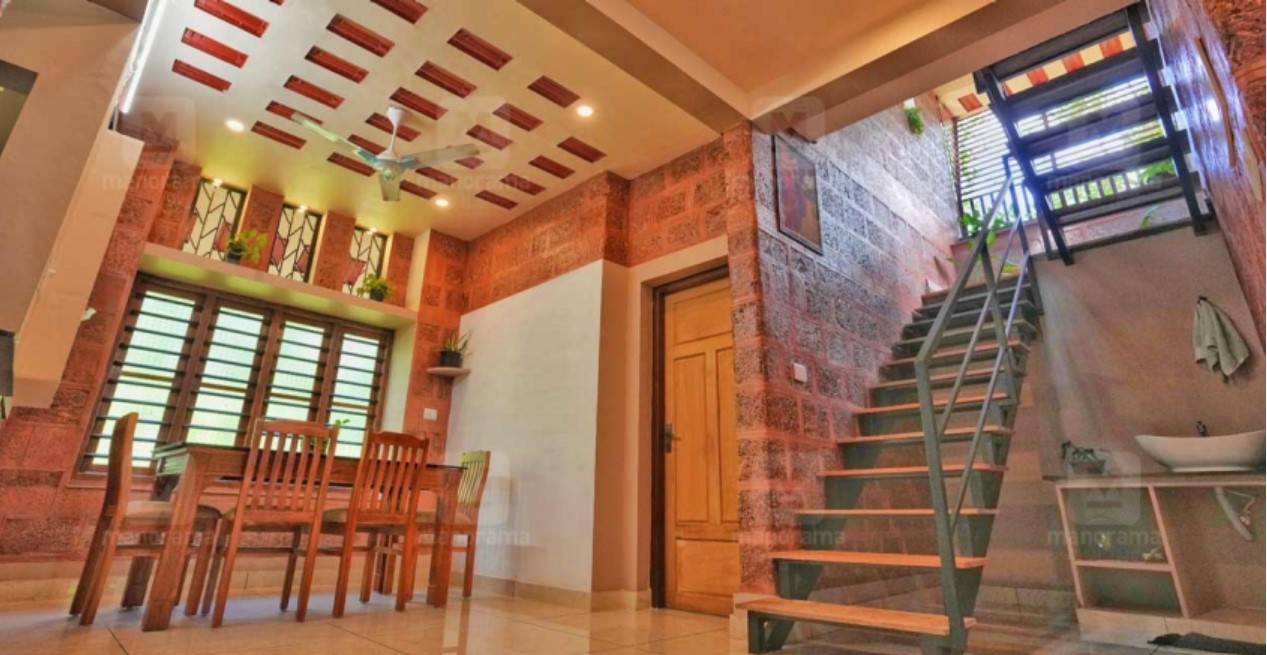 the stairs of the sustainable house in thrissur made of recycled wood and metal