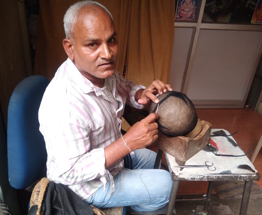 Marisetty Kumar making a wig