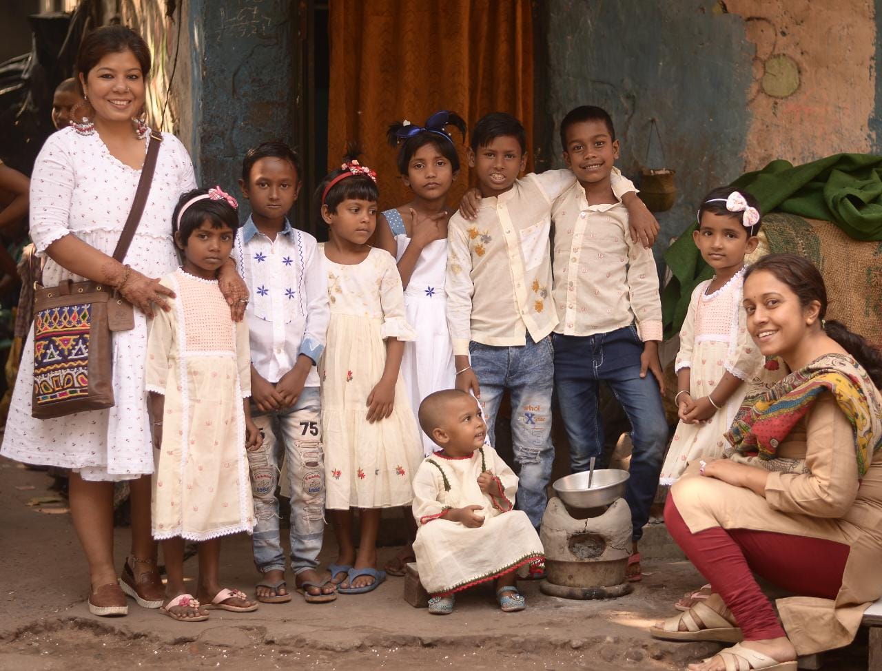 Anushree and Arpita with the children of Khudey, a kids clothing brand where ragpickers stitch and tailor the garments