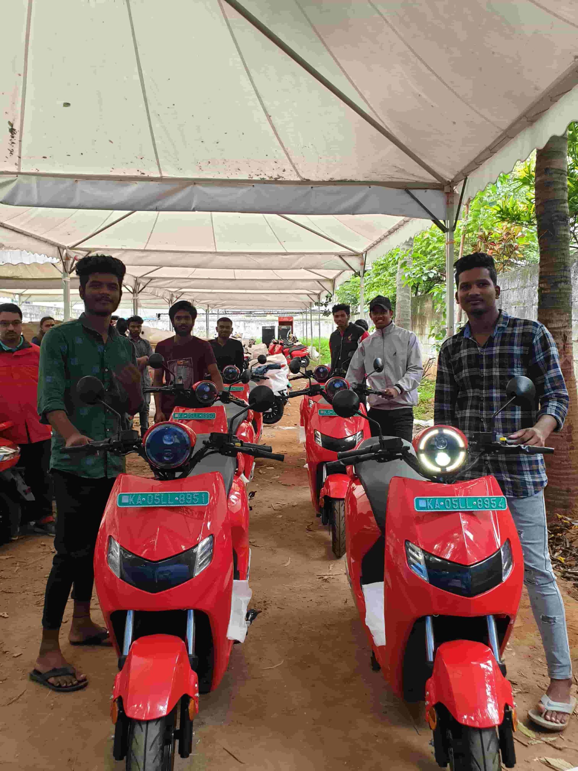 Swytchd employees with red Bounce Infinity vehicles.