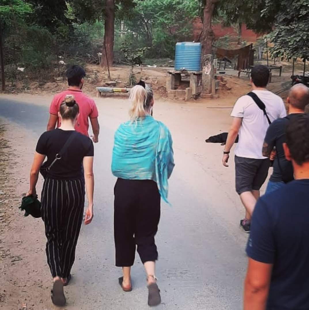 tourists walk through agra 