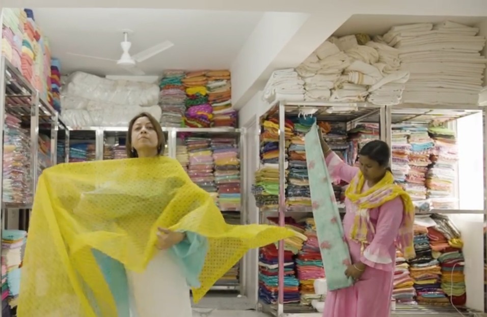 anjali agarwal and a weaver at kota doria silk examine the fabrics 