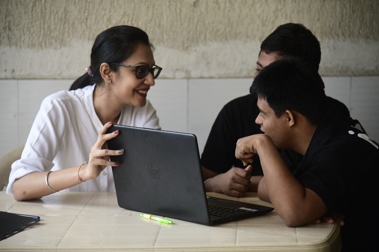 A teacher with students at Mann Centre.