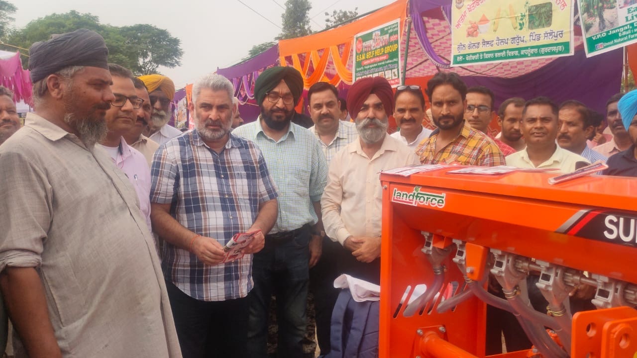 Officials with farmers.