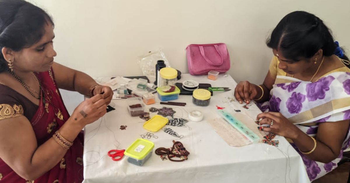 Women workers weaving bead jewellery.