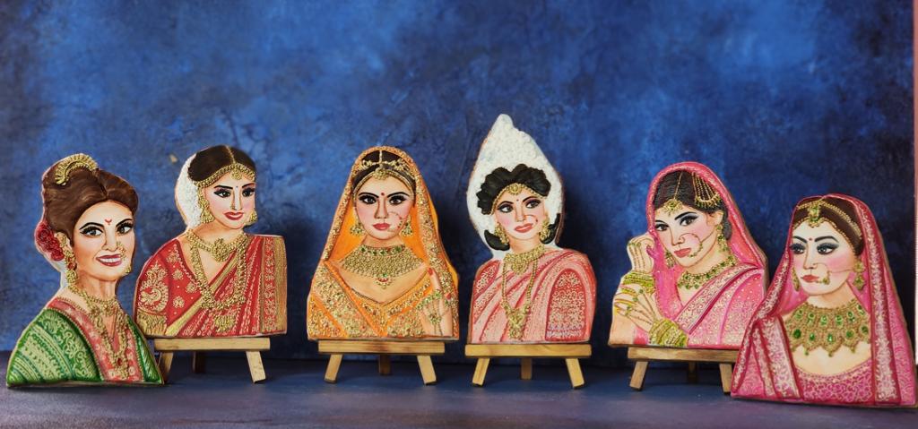 The edible art representing desi brides in various attires.