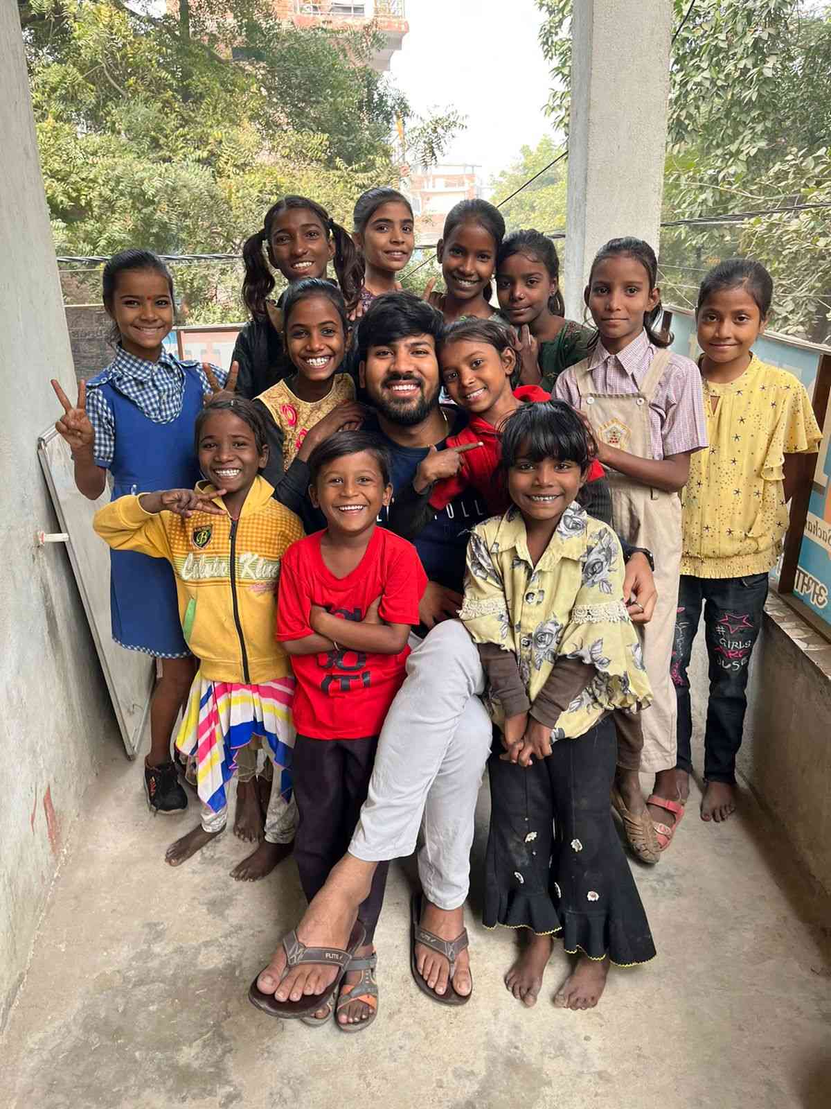 Uddeshya Sachan with the children of his school in Gurukulam, Khushiyon Wala School