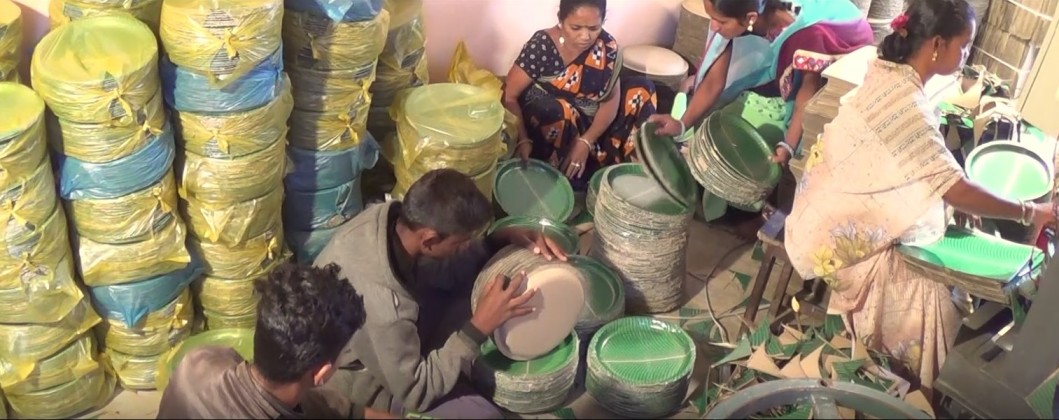 Employees packing plates at the factory.