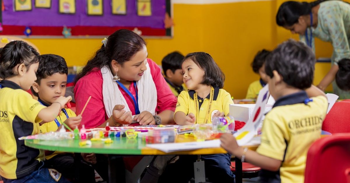 a teacher interacts with kindergarten children