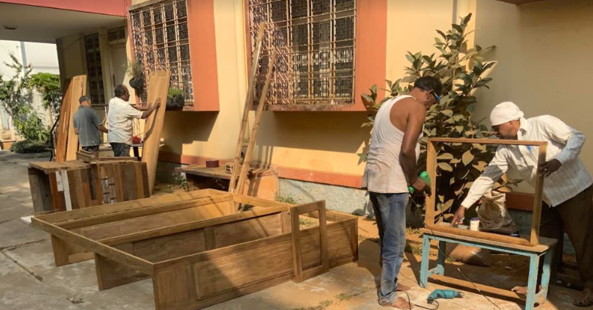 a team of carpenters work on the used wood 