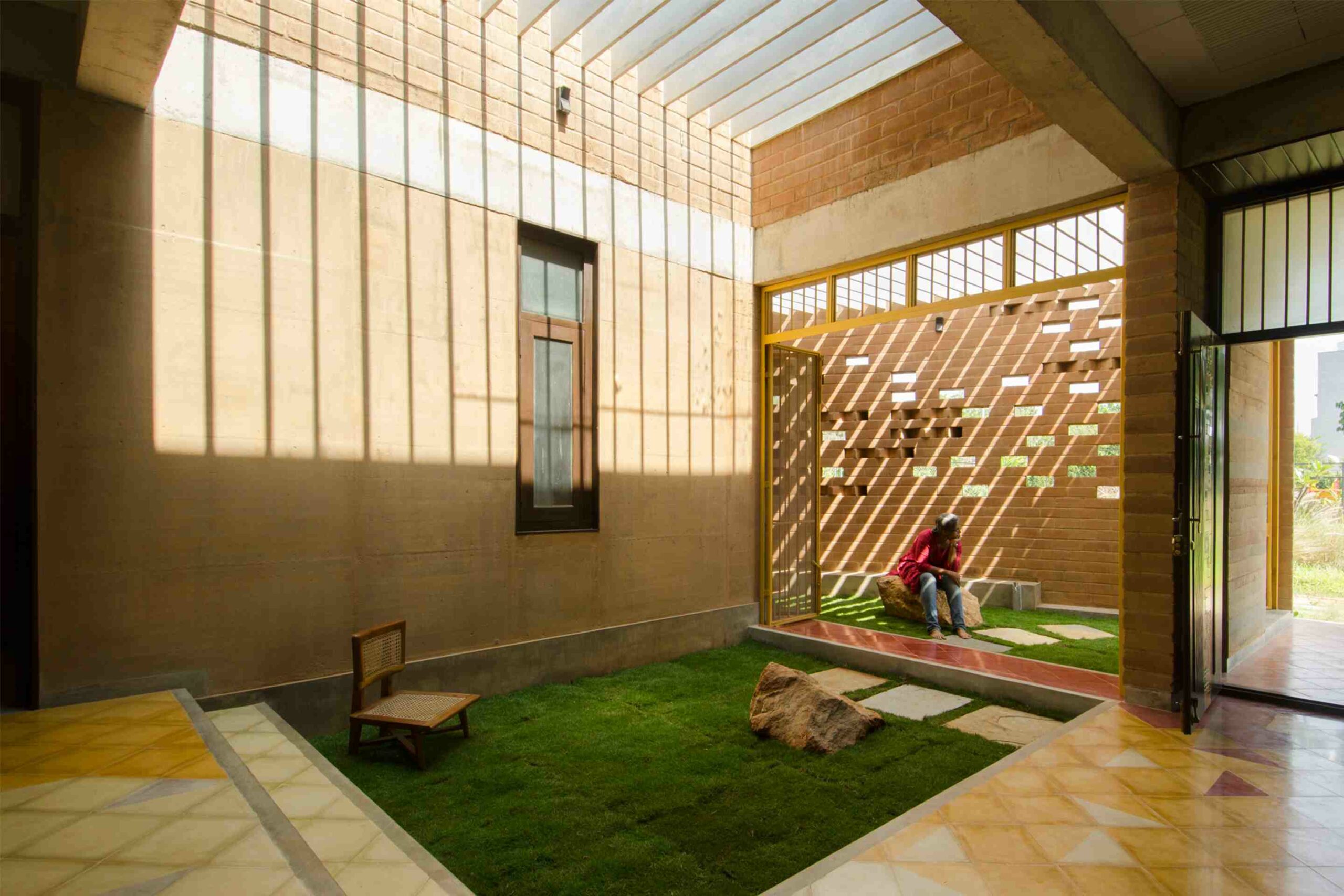The courtyard of the home has jaali (mesh) walls that allow the sunlight to percolate