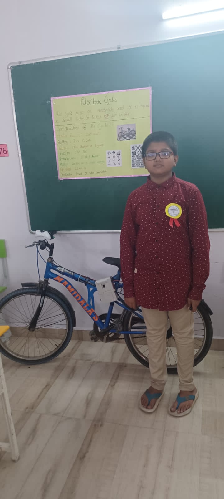 Abyudh with the electric bicycle that his dad created