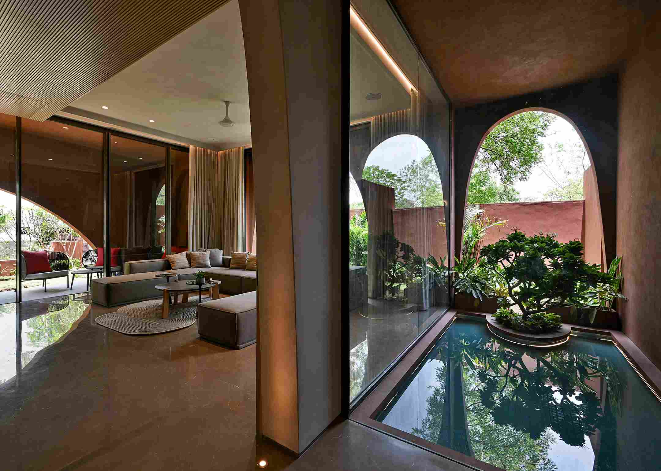 A central corridor runs through the house from east to west ending in a pool of water
