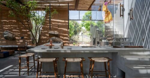 With Walls Made of Debris, Stunning Home Amid Mango Grove Reduces Carbon Footprint
