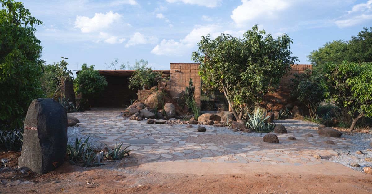 The house is built like a camouflage around nature going on the farm.