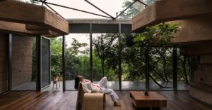 Built Amid a Canopy of Trees, This Sustainable Mud Home Is Made with 4000 Plastic Bottles