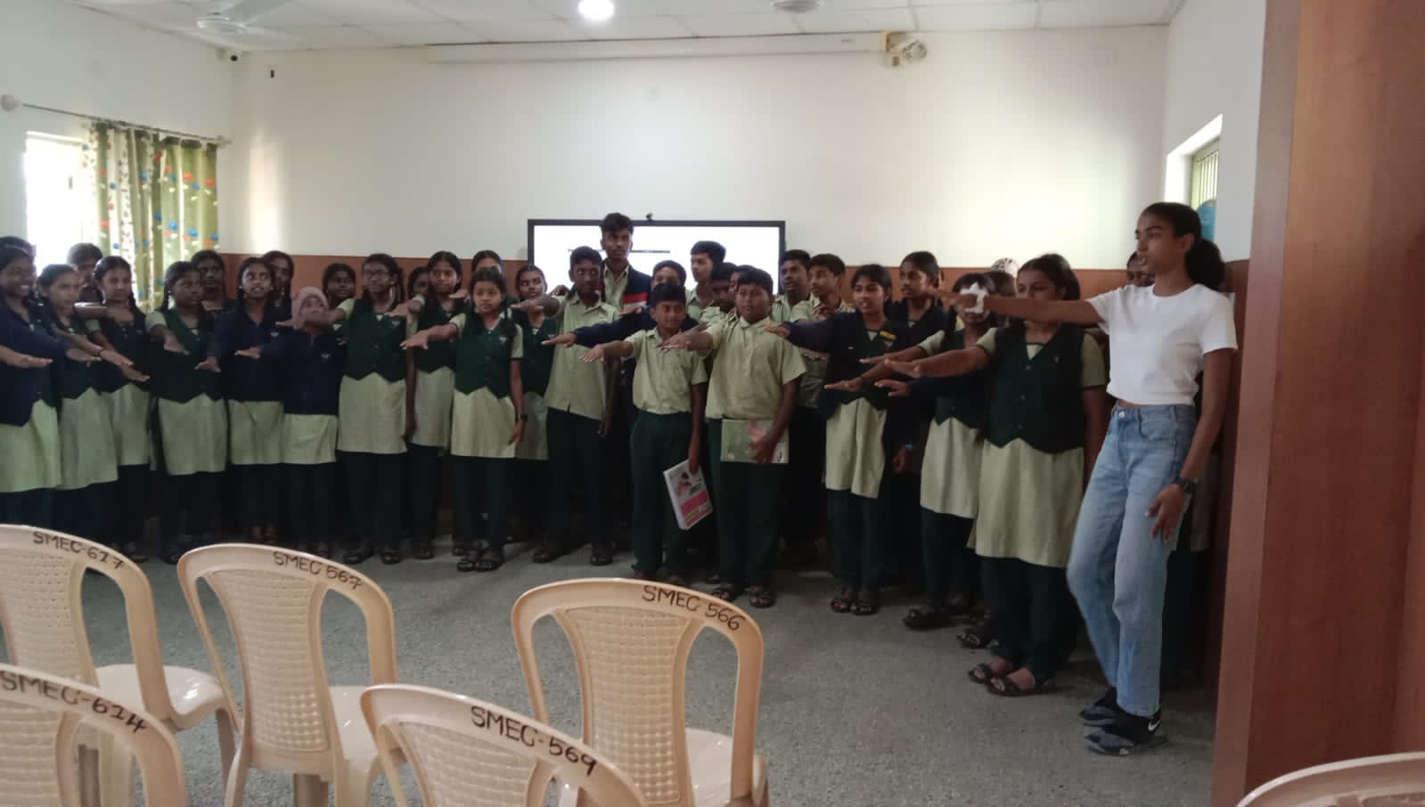 Divaa conducting an awareness session at a school in Karnataka