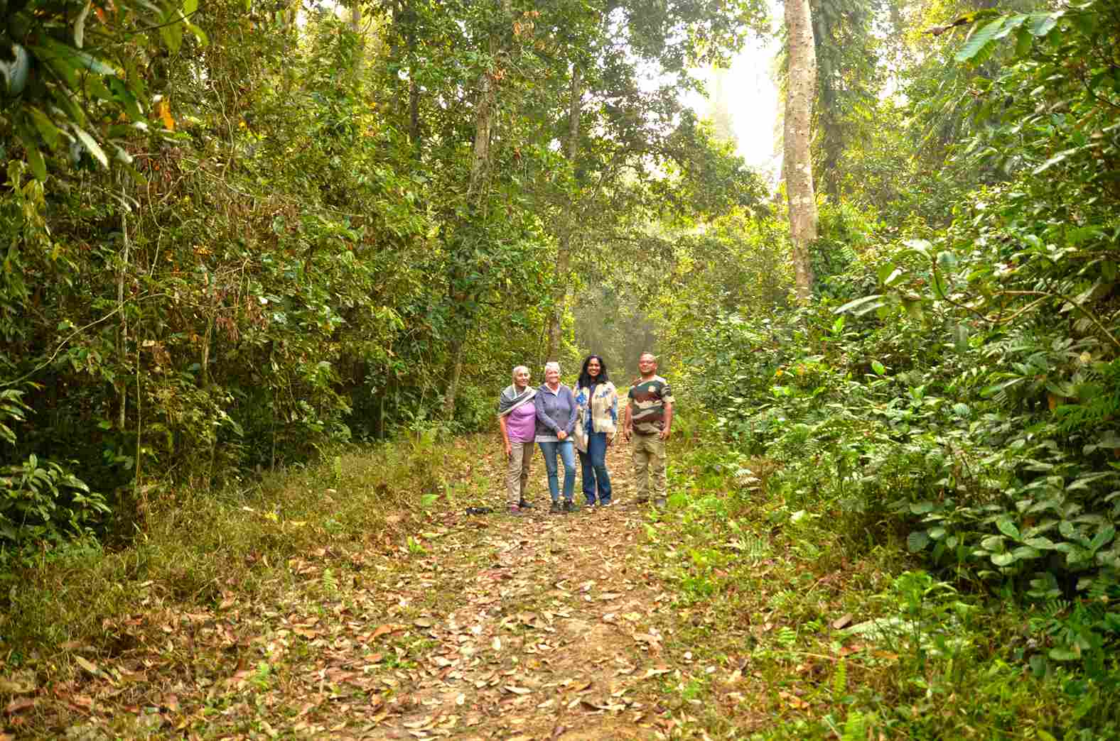 Guests enjoy a walk at Hollongapar Gibbon Sanctuary with guide