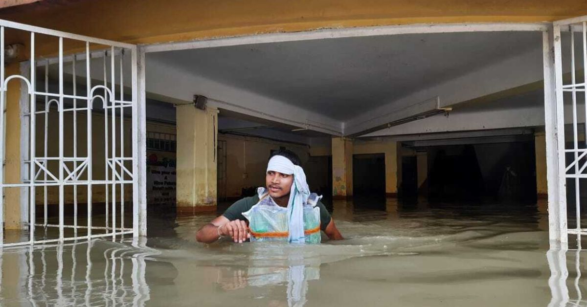 A man wearing the life jacket during Assam flood.