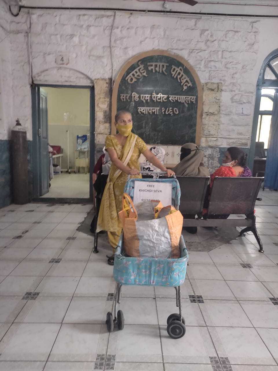 Kiran enters the hospital with her trolley every noon and begins serving khichdi to the patients
