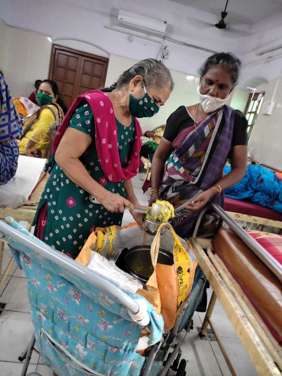 Kiran Kamdar doling out khichdi to the patients and their families