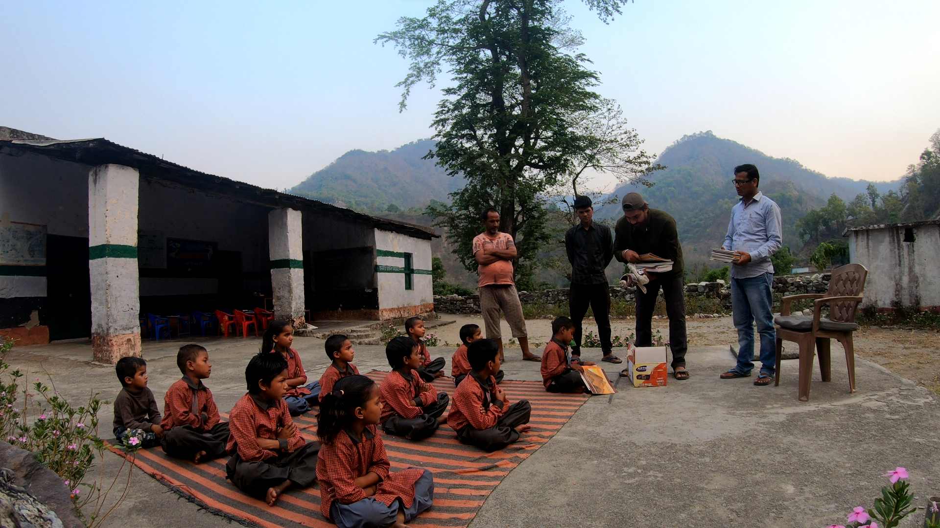 Nikhil and his team frequently distribute educational material to students in government-run schools in Uttarakhand