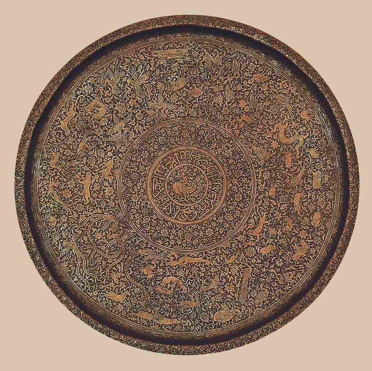 Circular salver (thali) with animals and birds amid animated floral arabesques
copper